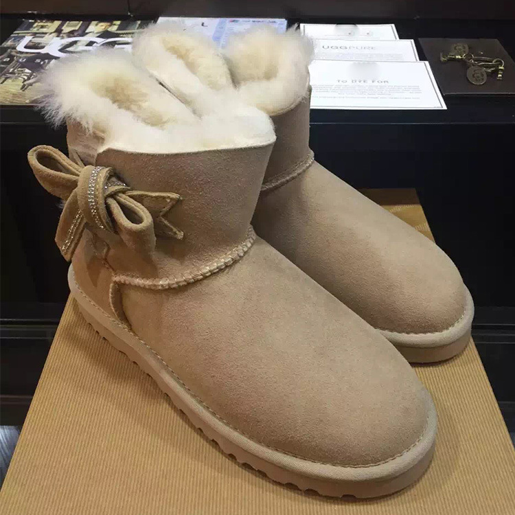 雪靴女時尚蝴蝶水鉆圓頭平底防滑厚底真皮毛一體保暖百搭女靴批發・進口・工廠・代買・代購